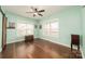 Green bedroom showcasing multiple bright windows at 175 Riley'S Dr, Salisbury, NC 28146