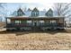 Inviting two-story home with a metal roof and a charming, spacious porch at 175 Riley'S Dr, Salisbury, NC 28146