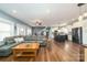 Spacious living room features hardwood floors, a large sofa, and lots of light at 175 Riley'S Dr, Salisbury, NC 28146