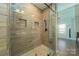Walk-in shower with glass door and wood-look tiled walls at 175 Riley'S Dr, Salisbury, NC 28146