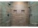 Modern shower boasts sleek tile walls and dual shower heads at 175 Riley'S Dr, Salisbury, NC 28146