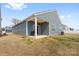 The backyard features a well-maintained lawn and patio perfect for entertaining at 1949 Vanderlyn St, Monroe, NC 28112