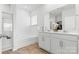 Clean bathroom featuring a large mirror, double vanity, and a tub with shower at 1949 Vanderlyn St, Monroe, NC 28112