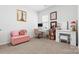 Cozy home office with a pink couch, built in makeup vanity and plenty of natural light at 1949 Vanderlyn St, Monroe, NC 28112