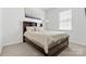 Comfortable bedroom featuring a bed with a headboard and ample natural light from the window at 1949 Vanderlyn St, Monroe, NC 28112