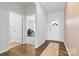 Welcoming entryway with wood floors and designer wallpaper, leading to a home office space at 1949 Vanderlyn St, Monroe, NC 28112