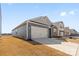 Beautiful home with a spacious two-car garage and an extended driveway and manicured front yard at 1949 Vanderlyn St, Monroe, NC 28112
