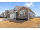 Charming single-Gathering home with stone and siding, complemented by a well-manicured lawn at 1949 Vanderlyn St, Monroe, NC 28112