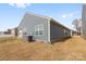 The exterior of the home shows a well-maintained lawn and central air conditioning unit at 1949 Vanderlyn St, Monroe, NC 28112