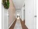 Bright and spacious hallway with decorative wallpaper, hardwood floors and natural light at 1949 Vanderlyn St, Monroe, NC 28112