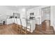 Well lit kitchen island with white cabinets, granite counter tops, stainless steel appliances, and bar seating at 1949 Vanderlyn St, Monroe, NC 28112