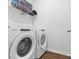 Functional laundry room equipped with a modern washer and dryer for convenience at 1949 Vanderlyn St, Monroe, NC 28112