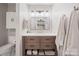 Modern bathroom with stylish vanity, sink, and a mirror at 201 Oak Creek Dr, Charlotte, NC 28270