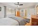 Bright bedroom featuring wood floors, and a bathroom doorway at 201 Oak Creek Dr, Charlotte, NC 28270