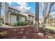 A charming home with a stone pathway and mature trees in a landscaped yard at 201 Oak Creek Dr, Charlotte, NC 28270