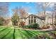 Backyard view of home, with a brick path and a lush lawn at 201 Oak Creek Dr, Charlotte, NC 28270