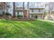 Charming two-story home featuring a well-maintained lawn and an attached two-car garage at 201 Oak Creek Dr, Charlotte, NC 28270