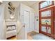 Bright foyer features a modern front door, hardwood floors, and closet storage at 201 Oak Creek Dr, Charlotte, NC 28270