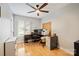 Bright home office features natural light, ceiling fan and hard wood floors at 201 Oak Creek Dr, Charlotte, NC 28270