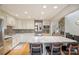 Updated kitchen with stainless steel appliances, granite countertops, breakfast bar, and open layout to living spaces at 201 Oak Creek Dr, Charlotte, NC 28270