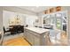 Open concept layout featuring a kitchen with breakfast bar flowing into the dining and living areas at 201 Oak Creek Dr, Charlotte, NC 28270