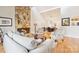 Open living room and dining area with stone fireplace and hardwood floors at 201 Oak Creek Dr, Charlotte, NC 28270