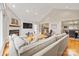 Cozy living room with a fireplace, vaulted ceiling, and an open floor plan that connects to the kitchen at 201 Oak Creek Dr, Charlotte, NC 28270