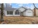 Charming single-story home with black shutters, a garage, and fresh landscaping at 2024 Hedgelawn Dr, Charlotte, NC 28262