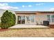 Inviting backyard with a patio, sliding glass door, and beautiful landscaping to create a peaceful outdoor retreat at 2036 Hudson Ln, Fort Mill, SC 29707