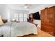 Cozy bedroom featuring a large bed, natural light, and a functional built-in desk at 2036 Hudson Ln, Fort Mill, SC 29707