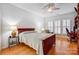 Bright bedroom with hardwood floors, natural light, and a comfy spot to relax at 2036 Hudson Ln, Fort Mill, SC 29707
