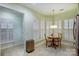 Eat-in dining area with natural light, plantation shutters and round wooden table at 2036 Hudson Ln, Fort Mill, SC 29707
