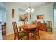 Traditional dining room featuring wood floors, decorative art and view to kitchen area at 2036 Hudson Ln, Fort Mill, SC 29707