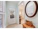 Bright entryway featuring a glass-paneled door, neutral walls, and a view into the dining area at 2036 Hudson Ln, Fort Mill, SC 29707