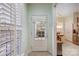 Bright entryway featuring a glass-paneled door, neutral walls, and a view into the dining area at 2036 Hudson Ln, Fort Mill, SC 29707