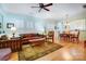 Inviting living room with hardwood floors, comfortable seating, and a ceiling fan at 2036 Hudson Ln, Fort Mill, SC 29707