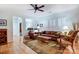 Cozy living room with hardwood floors, large windows and comfortable seating, bathed in natural light at 2036 Hudson Ln, Fort Mill, SC 29707