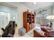 Office area with views to other rooms, a custom bookcase and comfortable seating area at 2036 Hudson Ln, Fort Mill, SC 29707