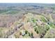 An aerial view showcasing the property's location among lush greenery and neighboring homes in a serene setting at 2504 Hovis Rd, Lincolnton, NC 28092