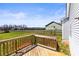 A wooden deck provides an outdoor space with a backyard view, and a fence separates the home from adjacent properties at 2504 Hovis Rd, Lincolnton, NC 28092