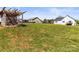 Expansive backyard featuring a chicken coop with a well-maintained lawn, perfect for outdoor activities and relaxation at 2504 Hovis Rd, Lincolnton, NC 28092