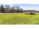 Spacious fenced backyard featuring a functional chicken coop and plenty of green space for outdoor enjoyment at 2504 Hovis Rd, Lincolnton, NC 28092