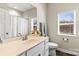 Well-lit bathroom with single vanity, white cabinets, and a window at 2504 Hovis Rd, Lincolnton, NC 28092