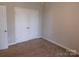 Bedroom with double door closet, light walls, and carpet flooring at 2504 Hovis Rd, Lincolnton, NC 28092