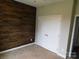 Bedroom with wood accent wall, carpet flooring and double door closet at 2504 Hovis Rd, Lincolnton, NC 28092