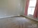 Clean and neutral bedroom with a carpeted floor and natural light at 2504 Hovis Rd, Lincolnton, NC 28092