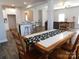 Dining area with hardwood floors, an open-concept design, and a kitchen island at 2504 Hovis Rd, Lincolnton, NC 28092