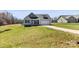 Attractive single-Gathering home with a two-car garage, lush green lawn, and inviting front porch at 2504 Hovis Rd, Lincolnton, NC 28092