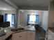 View of a kitchen and dinning room featuring granite countertops, lighting and dining table at 2504 Hovis Rd, Lincolnton, NC 28092