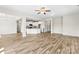 Spacious living room featuring modern wood floors and a seamless open-concept layout with access to the kitchen at 2504 Hovis Rd, Lincolnton, NC 28092